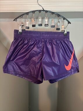 Nike Women's Purple Athletic Shorts with Neon Coral Swoosh